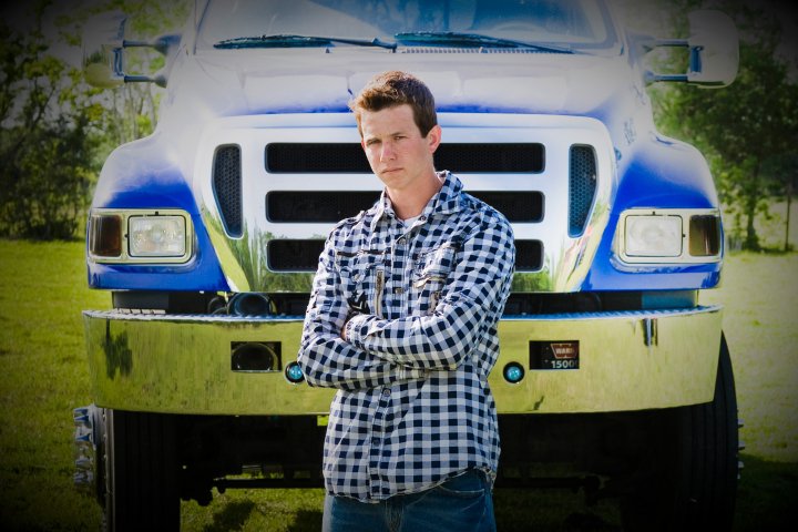 boy in front of truck
